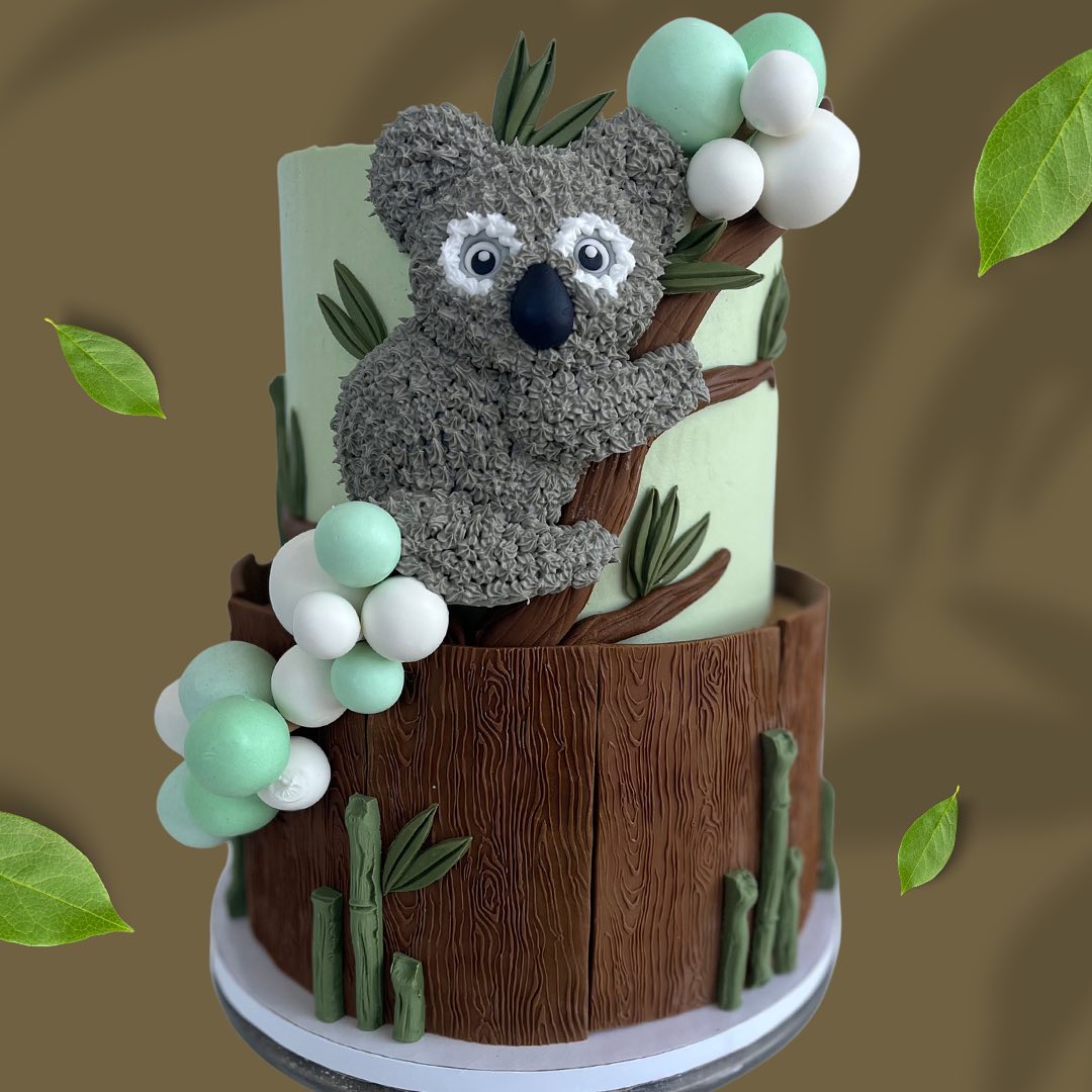 Koala-themed two-tier birthday cake